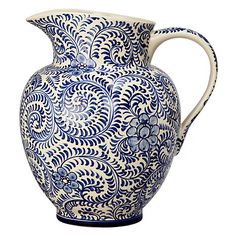 a blue and white vase is shown on a white background