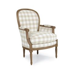 an upholstered chair with checkered fabric