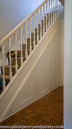 the stairs in this house are white and have wood treading on them as well