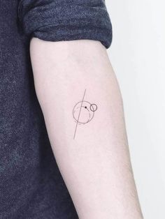 a person with a small tattoo on their arm