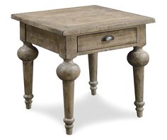 an old wooden table with two drawers on one side and three legs on the other