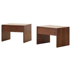 two wooden tables sitting next to each other