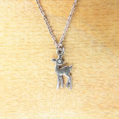 ♥ Deer Necklace Silver Deer Charm Necklace Deer Charm Deer Jewelry Deer Gift Personalized Gift ♥ You will receive 1 necklace ♥ Deer Charm 22 x 11 x 1 mm ♥ Stainless steel chain 18 inches If you need help with your first purchase on Etsy, here is a helpful guide http://www.etsy.com/help/article/339 ♥ We strive for next day shipping, but we do not ship on Saturdays, Sundays, and Holidays. It may sometimes take a bit longer when we have unusually large volume of orders. Thank you for your patience! Valentine's Day Silver Jewelry For Holiday, Silver Necklace For Birthday And Christmas, Handmade Silver Necklace For Christmas, Personalized Silver Charm Necklaces For Christmas, Personalized Silver Charm Necklace For Christmas, Nickel-free Silver Necklaces For Christmas, Nickel-free Silver Necklace For Christmas, Angel Wing Gifts, Deer Necklace For Men