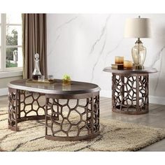 two tables sitting on top of a rug in front of a white and brown wall