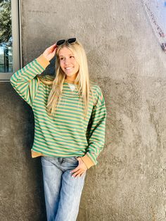 Taupe & green striped crewneck pullover sweater true to size, model is wearing a small Striped Crew Neck Sweater For Spring, Casual Striped Sweater For Spring, Striped Relaxed Fit Sweatshirt For Fall, Crew Neck Tops With Contrast Stripes For Fall, Casual Sweater With Striped Sleeves For Fall, Trendy Striped Sweatshirt For Fall, Green Sweatshirt For Layering In Fall, Casual Striped Sleeves Sweater For Fall, Green Tops With Ribbed Cuffs For Fall