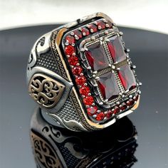 Silver Man Large Ruby Ring , Handmade Ottoman Style Red Stone Square Ring, Big Red Stone Ring , Zircon Stone Ring, 925k Sterling Silver Ring ★Item Details * Gender : Male / Female * Material : 925K Sterling Silver * Total weight : 42 Grams * Gemstone : Ruby  Stone ✔ Ready to Ship in 1-2 Business Days .. ✔ Shipped to the Worldwide 1-5 business days with free shipping... ✔ The product will be sent to you with a handmade wooden box to avoid any damage during shipping... ✔ Visit our store, browse other Men's jewelry, silver and gold collections, and find the perfect piece you're looking for... Click For Our Other Products https://www.etsy.com/shop/MercansilverTR?ref=simple-shop-header-name&listing_id=1003010735 Man Rings, Rubin Ring, Handmade Ottomans, Red Stone Ring, Ottoman Styling, Square Ring, Square Rings, Ruby Stone, Gold Collection