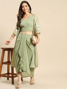 Crop Top With Dhoti Skirt And Shrug Set vitansethnics Summer Georgette Palazzo Set With Traditional Drape, Traditional Drape Georgette Palazzo Set For Summer, Summer Traditional Drape Georgette Palazzo Set, Summer Traditional Drape Palazzo Set In Georgette, Summer Traditional Georgette Pre-draped Saree, Summer Traditional Drape Pre-draped Georgette Saree, Summer Reception Georgette Sharara, Pista Green Sharara For Party, Fitted Pista Green Georgette Palazzo Set