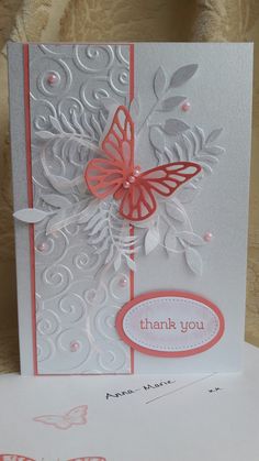 a thank you card with a butterfly on the front and side, in pink and white