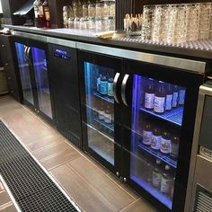 a bar with several bottles and glasses on it