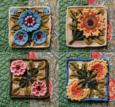 four crocheted squares with flowers and leaves in them on a quilted surface