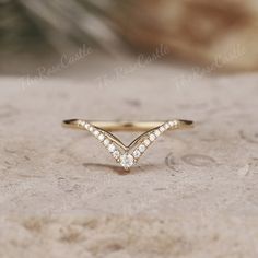 Unique Moissanite Wedding Band Yellow Gold Moissanite Curved Wedding Ring Art Deco Stacking Matching Chevron Ring Promise Rings For Women ITEM DETAILS ●Available in yellow, white or rose solid 10k, 14k or 18k gold. This ring can be made in Platinum. ❀❀Wedding band  Stone: Moissanite Shape: Round Shape Weight: about 0.106ct Band width around 1.3mm Visit my shop for more jewelry: https://www.etsy.com/shop/TheRoseCastle if you would like to customize your unique ring, you may contact us about your ideas and pictures. Hope I could get the chance to create fabulous rings for you! ❀Production ---- This ring is handmade and very good quality! Please allow 2-4 weeks for production. It can be made to any ring size.  ❀Engraving service We accept the engraving order, leave a note when placing an orde Yellow Gold Chevron Wedding Band, Marquise Rings, Chevron Engagement Ring, Chevron Wedding Band, Wedding Band Yellow Gold, Curved Wedding Ring, Wedding Ring Art, Wedding Rings Art, Chevron Wedding