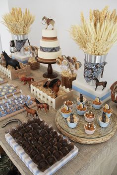 a table topped with lots of cakes and desserts