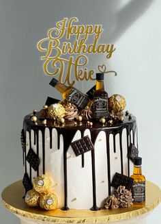 a birthday cake decorated with chocolate and candies