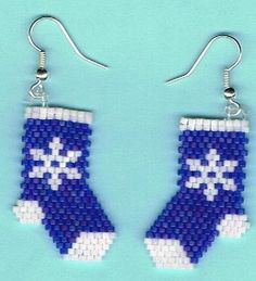 two pairs of blue and white beaded earrings with cross stitching on the side