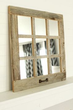 an old window is hung on the wall