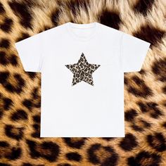 Leopard Print Shirt - Revamp your wardrobe with Everlace Designs' exclusive collection of essential tees, cozy hoodies, and playful baby tees in signature prints. Shop now for vibrant, cheeky designs perfect for any casual occasion. Elevate your everyday style with Everlace! 🍒 Connect with Everlace Designs: We invite you to join our community and stay updated with our latest designs and content. Follow us on: TikTok: @everlace.designs  Instagram: @everlacedesigns Pinterest: @everlacedesigns Be Animal Print Tshirt, Graphic Print Tshirt, 90s Leopard Print, Leopard Print T Shirt, Leopard Print Graphic Tee With Lettering, Leopard Print T-shirt With Letter Print And Crew Neck, Trendy Leopard Print Graphic T-shirt, Leopard Print Graphic Crew Neck Top, Baby Tee Shirts