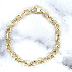 "➣ High quality 14K Yellow Gold 7.5\" Mini Oval Link Bracelet, 5mm Wide, Real Gold Bracelet, Women  ➣ MATERIAL: 14K Yellow Gold  ➣ Closure: Lobster   ➣ Solid / Hollow: Hollow  ➣ Weights:  7.5\" Barcelet - 3.8 Gram 18\" Chain - 7.4 Gram  ◈ Please note that weights are approximate.  ➣ If you need a specific length, please message us.  Explore more gold bracelets. https://www.etsy.com/shop/MarinaMJewelry?ref=seller-platform-mcnav&search_query=gold+bracelet  ➣ SHIPPING: ◈ We always offer domestic FR Classic Oval Cable Chain Bracelets, Everyday Gold Oval Bracelet With Cable Chain, Classic Everyday Oval Gold Bracelet, Classic Oval Gold Jubilee Bracelet, Classic Oval Chain Bracelet With Lobster Clasp, Classic Oval Bracelet For Everyday, Everyday Oval Polished Bracelets, Real Gold Bracelet, Gold Armband