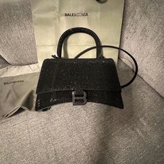 Nwt$6,850 Balenciaga Hourglass Xs Black Crossbody Handbag In Black Rhinestone Best Offers Are Accepted Hourglass Xs Handbag Straight From Berdof Goodman Receipt Included Suede Calfskin And Rhinestones Handbag Curvilinear Base One Handle Studded Magnet Closure B Logo Hardware With Rhinestones 1 Back Pocket 1 Inner Patch Pocket Nappa Lambskin Lining Wipe With A Soft Cloth Made In Italy Size 7.4''W X 5.1''H X 3.1''D Adjustable And Removable Crossbody Strap, 21.6'' Modern Shoulder Bag With Branded Hardware For Party, Luxury Handheld Evening Bag With Dust Bag, Elegant Party Shoulder Bag With Branded Hardware, Elegant Party Bags With Branded Hardware, Designer Bags With Silver-tone Hardware For Night Out, High-end Evening Bags With Branded Hardware, High-end Shoulder Bag With Branded Hardware For Parties, High-end Party Shoulder Bag With Branded Hardware, Designer Handheld Evening Shoulder Bag