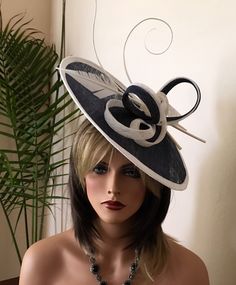 "This beautiful cocktail navy blue and white saucer shape fascinator is made of sinamay and embelished with white/navy sinamay bows and turkey and ostrich quills feathers. Mounted on a 6\" base and a headband. It's perfect for the opening day at the races, Kentucky Derby,Royal Ascot, wedding, any cocktail or holiday party or any other occasion. this fascinator hat definitely makes a great statement at any event. Looks absolutely lovely! Please check with me on availability of any other color cho Kentucky Derby Outfit, 20’s Style, Ivory Fascinator, White Fascinator, Royal Ascot Hats, Derby Outfits, Derby Hats Fascinators, Day At The Races, Couture Hats