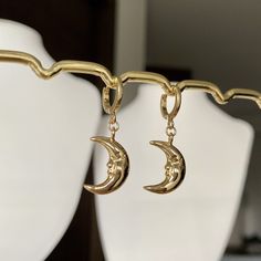 🌙Gold plated Crescent moon hoop earrings, Crescent moon huggies, Crescent moon dangle earrings Crescent moon dangle earrings are a popular style of earrings that feature a design resembling the shape of a crescent moon🌙 they gently sway and catch the light as you move, making them eye-catching and charming earrings🌝💛 * Hypoallergenic jewelry  * Hoop size: 11mm * Charm size: 13mmx11mm * Gold plated brass It comes with gift wrapped🎁 Free tracked shipping in the UK🚛 Shipped same or next business day🤍 Message me anytime for any questions💙   All earrings can also be made into necklaces.            Please message me separately ❤️ Follow us on Instagram: blueminglondon ❤️ Gold Moon-shaped Cartilage Earrings, Gold Moon Shaped Cartilage Earrings, Dainty Half Moon Charm Earrings, Dainty Half Moon Earrings With Moon Charm, Moon Charm Hoop Earrings In Celestial Style, Moon-shaped Hoop Earrings As Gift, Moon Shaped Hoop Earrings Gift, Gold Half Moon Hoop Earrings With Moon Charm, Gold Crescent Hoop Earrings With Moon Phase