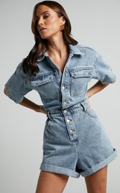 Step into spring with our Leo Denim Playsuit. This collared, short sleeve button front playsuit in a mid blue acid wash is the perfect addition to your casual wardrobe. Made from 100% cotton denim, this fitted playsuit offers both comfort and style all in one. Whether you're heading out for brunch with friends or enjoying a sunny day at the park, this trendy piece will have you looking effortlessly chic. Embrace the versatility of this playsuit by dressing it up with heels or keeping it casual w Denim Jumpsuit Street Style, Denim Jumpsuit Fall, Jumpsuit Outfit Winter, Jumpsuit Outfit Fall, Jumpsuit Outfit Black, Denim Jumpsuit Outfit, Blue Playsuit, Denim Short Jumpsuit, Denim Playsuit