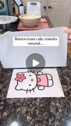 a video demonstrating how to make a buttercream cake transferer with hello kitty