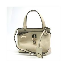 Br : Valentino Garavanimodel: Joylockcolor: Whitematerial: Pony-Style Calfskininclusions: Padlock (With Key) Shoulder Strapdimensions: Height : 17 Cm X Width : 22 Cm X Depth : 10 Cmserial Number: Bg-Pa55vsl2country Of Origin: Italycondition: Ab - Good Condition.If You Have A Preference For A Relaxed Contemporary Style This Joylock Bag From Valentino Garavani Is An Ideal Choice! Its Exquisite Design Attracts Fashion-Conscious Individuals Especially Women.The Item Displays Minor Signs Of Use With Luxury Beige Bags With Lock, Luxury Beige Bag With Lock, White Bags With Lock For Everyday, Elegant White Bag With Lock, Elegant White Bags With Lock, White Travel Bags With Lock, Beige Bag With Lock For Daily Use, Beige Rectangular Bag With Lock, Rectangular Beige Bag With Lock