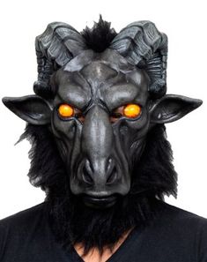 Summon the power of the occult with this devilish Baphomet Full Mask. Channel the forces of darkness and rule the underworld in this goat-like black full mask that features piercing yellow eyes, curling horns, and a long, frowning snout. Dimensions: 14” H x 12” W x 11” D Circumference: 26” around Material: Natural rubber latex Care: Spot clean Imported WARNING: Do not use if allergic to latex or ammonia Gothic Horned Masks For Fantasy Events, Spooky Black Mask For Masquerade, Spooky Black Masquerade Mask, Spooky Black Masks And Prosthetics For Masquerade, Spooky Black Masks For Masquerade, Horned Masks And Prosthetics For Halloween Costume Party, Horned Masks And Prosthetics For Halloween, Black Horror Masks For Fantasy Events, Black Horror Masks And Prosthetics For Fantasy Events