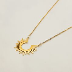 The Sun Necklace is such a fun statement piece. Wear it alone or layer it for different looks. Leave it on for 24/7 worry free wear because it's water safe, sweat proof, and won't turn your skin green. Measures 17 3/8" in length. FEATURES: Nickel & Lead Free Water Safe Sweat Proof Tarnish Resistant 14k Gold plating over 304 Stainless Steel (extreme durability) 1 Year Warranty Includes FREE microfiber pouch. TARNISH PROOF | 24/7 WEAR | 1 YEAR WARRANTY Made with real 18k gold and stainless steel g Necklace Sun, Celestial Sun, Sun Necklace, Gold Girl, Celestial Necklace, Girl Jewelry, Waterproof Jewelry, Summer Necklace, Layering Necklace