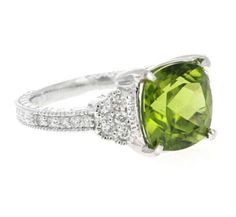 5.85 Carats Natural Very Nice Looking Peridot and Diamond 14K Solid White Gold Ring Suggested Replacement Value: $4,500.00 Total Natural Square Cushion Peridot Weight is: Approx. 5.50 Carats Natural Round Diamonds Weight: Approx. 0.35 Carats (color G-H / Clarity SI1-SI2) Ring total weight: 5 grams Disclaimer: all weights, measurements and colors are approximate and may vary slightly from the listed dimensions or as seen in the image. All pictures are magnified to show the smallest of details. Pl Green Cushion Cut Diamond Ring For Formal Occasions, Formal Peridot Diamond Ring With Center Stone, Elegant Lime Green Jewelry With Center Stone, Luxury Peridot Ring For Formal Occasions, Elegant Peridot Diamond Ring With Center Stone, Elegant Lime Green Gemstone Rings, Elegant Lime Green Rings For Anniversary, Elegant Lime Green Ring With Center Stone, Elegant Round Cut Peridot Diamond Ring