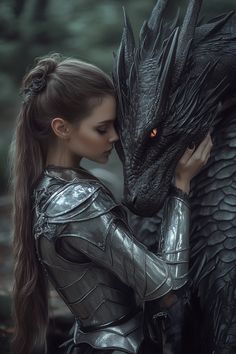 a woman is hugging a statue of a black dragon with red eyes and long hair