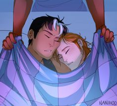 a man and woman laying in bed with their arms wrapped around each other's heads