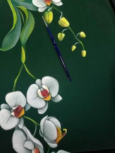 a painting of white flowers and green leaves on a black background with a blue pen