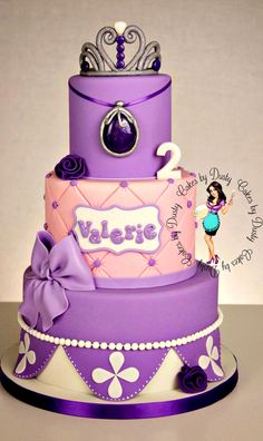 a purple and pink cake with the name valene on it's tiers