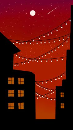 the night sky is red and orange with lights strung from it's wires in front of some buildings