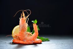 an orange shrimp is sitting on the table