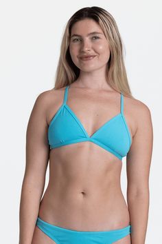 Inspired by the classic beach bikini, the Triangle swim top features tie straps to give you a perfect (and adjustable) fit and allows for top athletic performance. Features: Good for: Swim, Water Polo, Surfing, paddling, lifeguarding, ocean activities, pool activities, lifestyle Tie-back straps Lined for maximum privacy Medium coverage Medium impact Tagless for maximum comfort Chlorine proof Pill-resistant 2-way stretch Reinforced stitching Fabric Composition: Foreverever Fabric 100% Polyester E Solid Color Triangle Top Swimwear For Sports, Solid Triangle Top Swimwear For Sports, Sports Tankini For Beach Season With Triangle Top, Adjustable Seamless Solid Swimwear, Sporty Swimwear With Padded Cups For The Pool, Sporty Padded Swimwear For The Pool, Sporty Padded Swimwear For Pool, Beachwear Tankini With Triangle Top For Water Sports, Summer Swimwear For Water Polo With Strappy Back