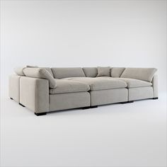 a large sectional couch sitting on top of a white floor