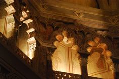 an ornately decorated building with intricate carvings on the walls and ceiling is lit by sunlight coming through windows