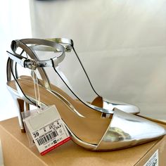 Zara Basic New Silver T Strap Heeled Sandal. Us 8 3.5” Heel & 3/8” Platform. One Small Ripple On Right Sandal Just Before Sole. I Have A Pair Of These I Wear And They Are Great, They Go With Everything And Are Comfy Too. Feel Free To Ask Any Questions You Might Have. I Pack Well And Ship Quickly. Thank You For Looking Silver Ankle Strap Kitten Heels For Summer, Silver Open Heel Kitten Heels For Spring, Zara Formal Sandals With Low Heel, Zara Sandals With 4-inch Heel For Formal Occasions, Zara Ankle Strap Heels, Zara Open Toe Heels For Wedding, Zara Fitted Closed Toe Heels, Zara Fitted Closed-toe Heels, Zara Ankle Strap Fitted Heels