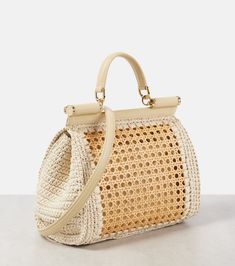 Sicily Medium leather-trimmed crochet tote bag in white - Dolce Gabbana | Mytheresa Luxury Woven Leather Straw Bag For Travel, Designer Rectangular Crochet Bag With Handles, Designer Crochet Rectangular Bag With Handles, Designer Rectangular Crochet Bag, Designer Woven Straw Travel Bag, Designer Woven Straw Bag For Travel, Designer Travel Straw Bag With Handles, Luxury Natural Straw Bag With Gold-tone Hardware, Designer Crochet Woven Bag