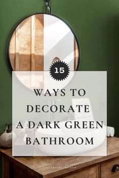 a bathroom with green walls and a round mirror over the sink, on top of a wooden dresser