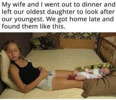 a woman laying on top of a bed next to a baby in a diaper