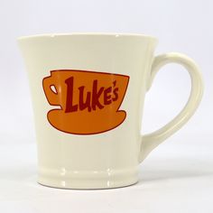 a coffee cup with the word luke's on it is shown in front of a white background