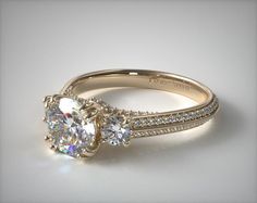 two stone engagement ring with diamond accents on the band and side stones in white gold