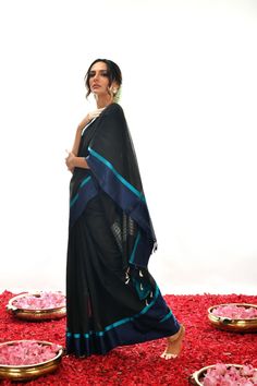 Crafted with care and expertise, this Handwoven Pure black Soft cotton by Kora Banarasi saree offers a unique look. Boasting a striking blue mashru silk border and a luxurious black color, this saree exudes a classy, elegant feel. Experience elegance and comfort like never before. Pure Black, Banarasi Saree, Saree Look, Banarasi Sarees, Beautiful Saree, Unique Charms, Blouse Piece, Silk Sarees, Hand Embroidered