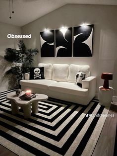 a living room with black and white decor