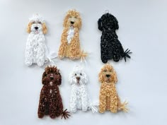 four beaded dogs sitting next to each other