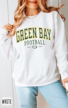 Get ready to show your unwavering support for Green Bay football with this sweatshirt. Whether you're cheering from the stands or watching from home, this cozy and stylish sweatshirt is the perfect way to represent your team. Made from high-quality materials, it's not just comfortable, but it also lets you wear your football pride loud and clear. As a fan, you understand the importance of tradition, and our sweatshirt embodies that spirit. Join the Packers' faithful and gear up for game day with Cheap Green Sweatshirt For Sports Events, Cheap Crew Neck Tops For Football Season, Cheap Green Sweatshirt For Game Day, Cheap Football Season Fan Gear Sweatshirt, Game Day Sweater With Letter Print And Crew Neck, Game Day Crew Neck Sweater With Letter Print, Varsity Letter Print Sweater For Game Day, College Style Sweatshirt With Ribbed Cuffs For Game Day, Collegiate Green Sweatshirt For Football Season