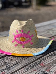 Brighten your spring or summer wardrobe with this hand-embroidered hat. It will add a pop of color to any outfit, and can be styled in so many different ways.Material: Palm.Sizes:Small * 54-55 cm (21-21 ½ inches).Medium *56-57 cm (21 ⅞- 22 ¼ inch... Embroidered Cowboy Hat, Evil Eye Embroidery, Colorful Evil Eye, Eye Embroidery, Embroidery Hat, Negative Vibes, Eye Motif, Canvas Hat, Raffia Hat